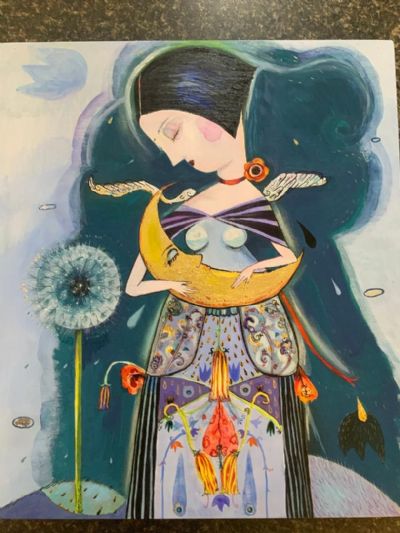 My sister holding the Moon